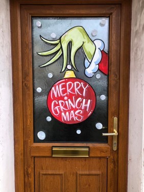 Christmas Window art - The Grinch holing a bauble