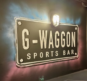 G-Waggon logo painted on wall at sports bar