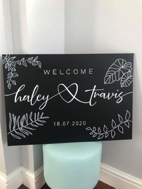 Wedding Welcome Sign on Blackboard with foliage plants flowers